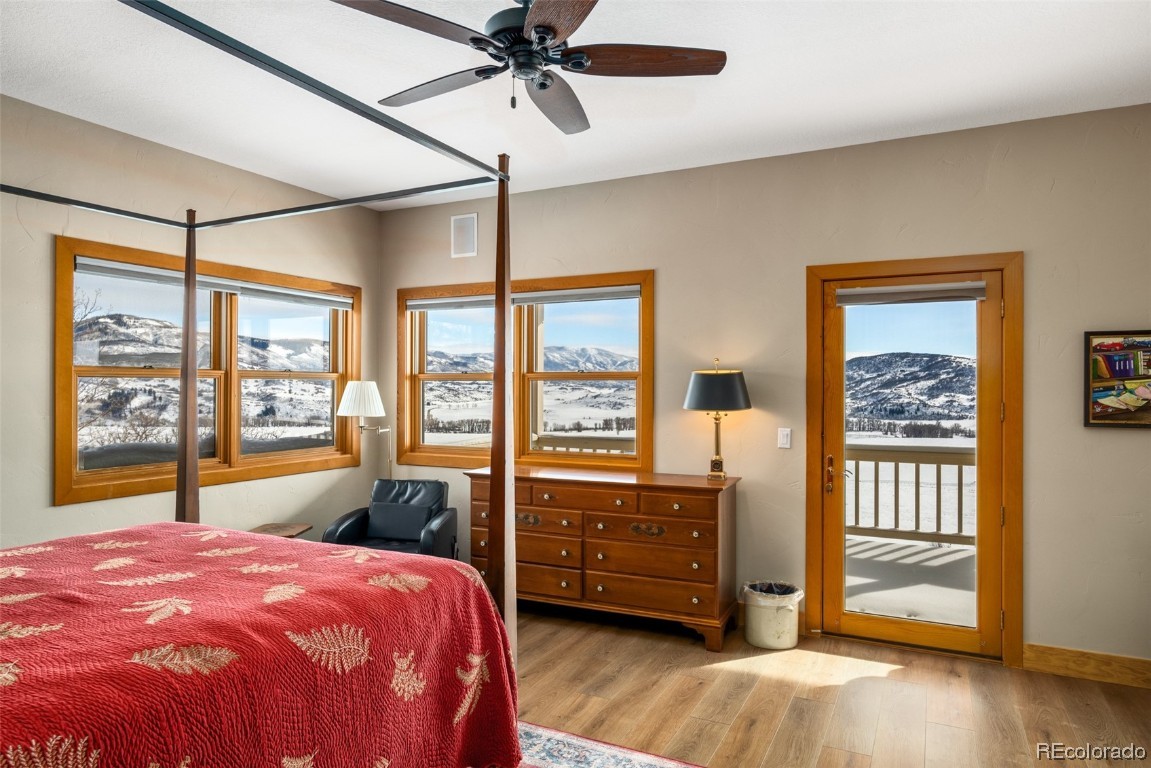 43750 Diamondback Way Steamboat Springs, CO 80487 - Photo 21 of 50 a bedroom with a bed dresser and a large window