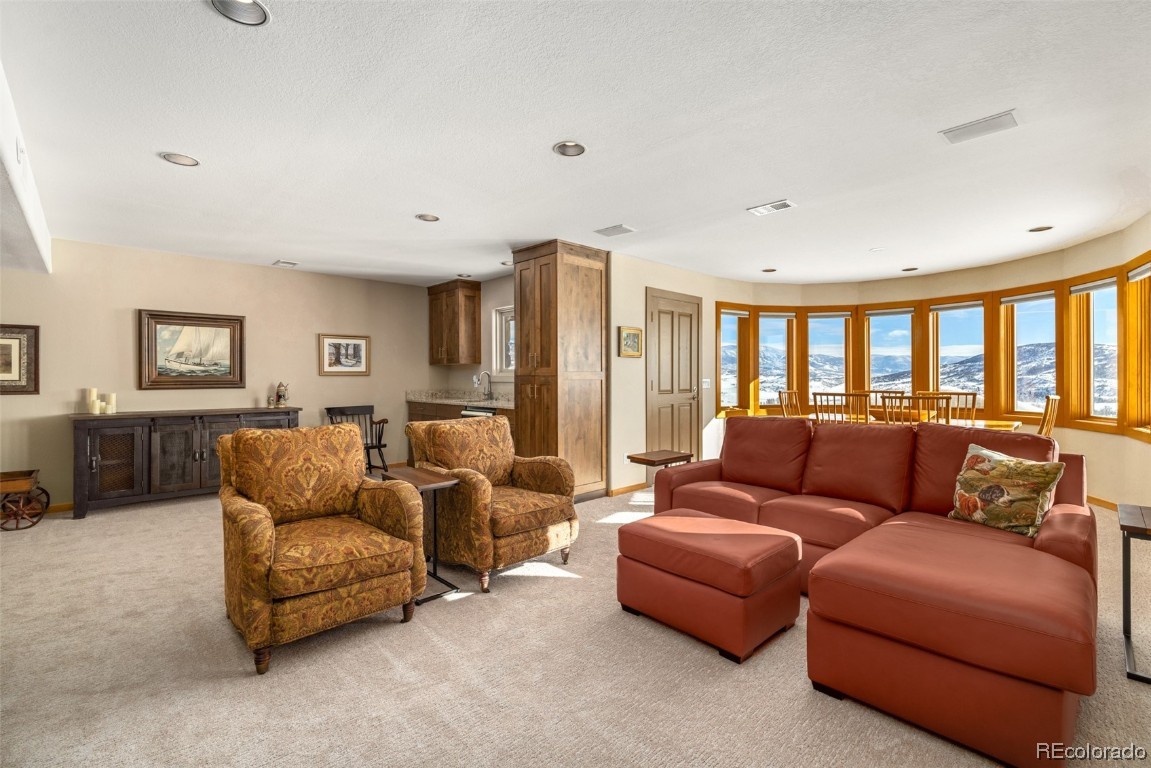 43750 Diamondback Way Steamboat Springs, CO 80487 - Photo 26 of 50 a living room with furniture and a window