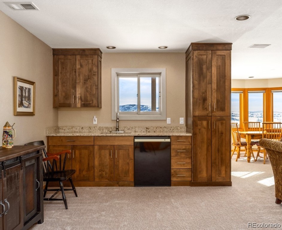 43750 Diamondback Way Steamboat Springs, CO 80487 - Photo 28 of 50 a kitchen with a sink and a refrigerator