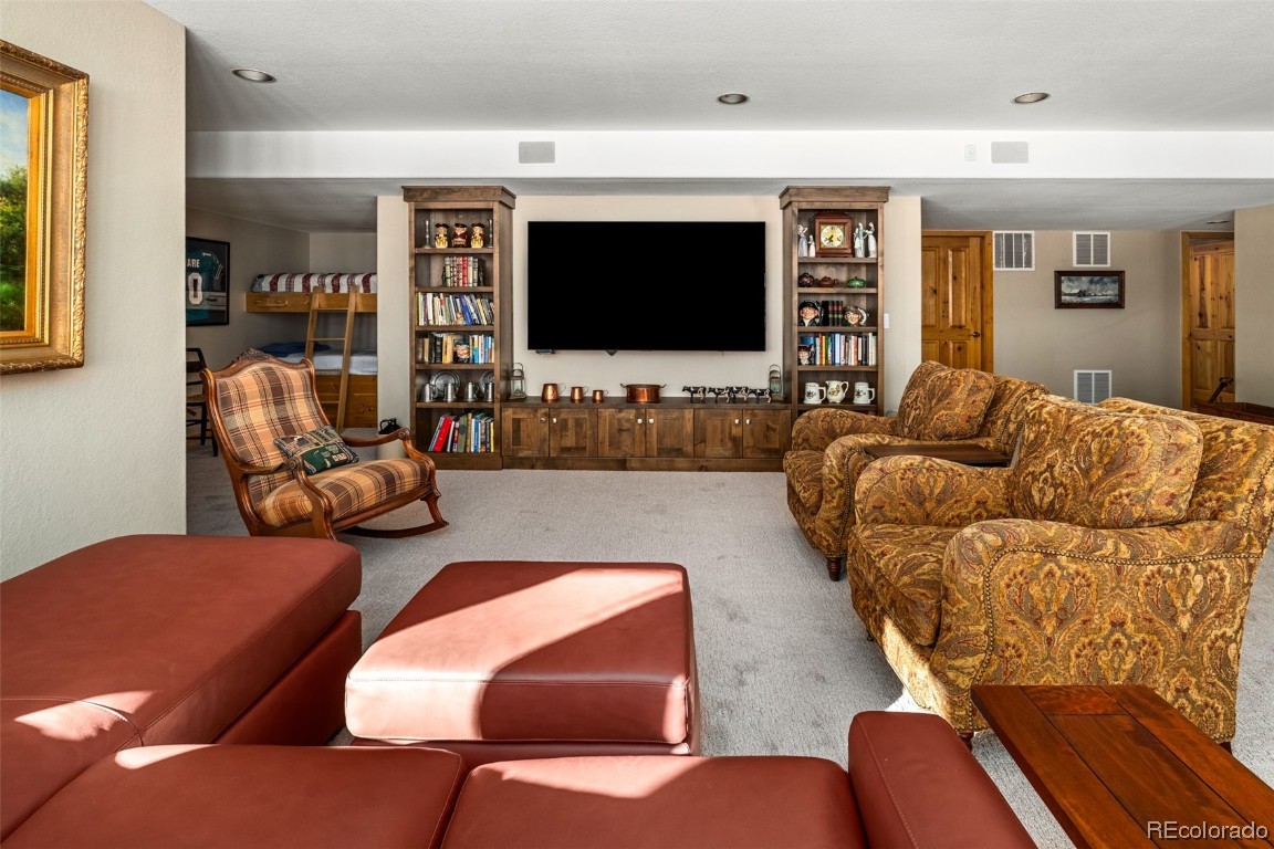 43750 Diamondback Way Steamboat Springs, CO 80487 - Photo 29 of 50 a living room with furniture and a flat screen tv