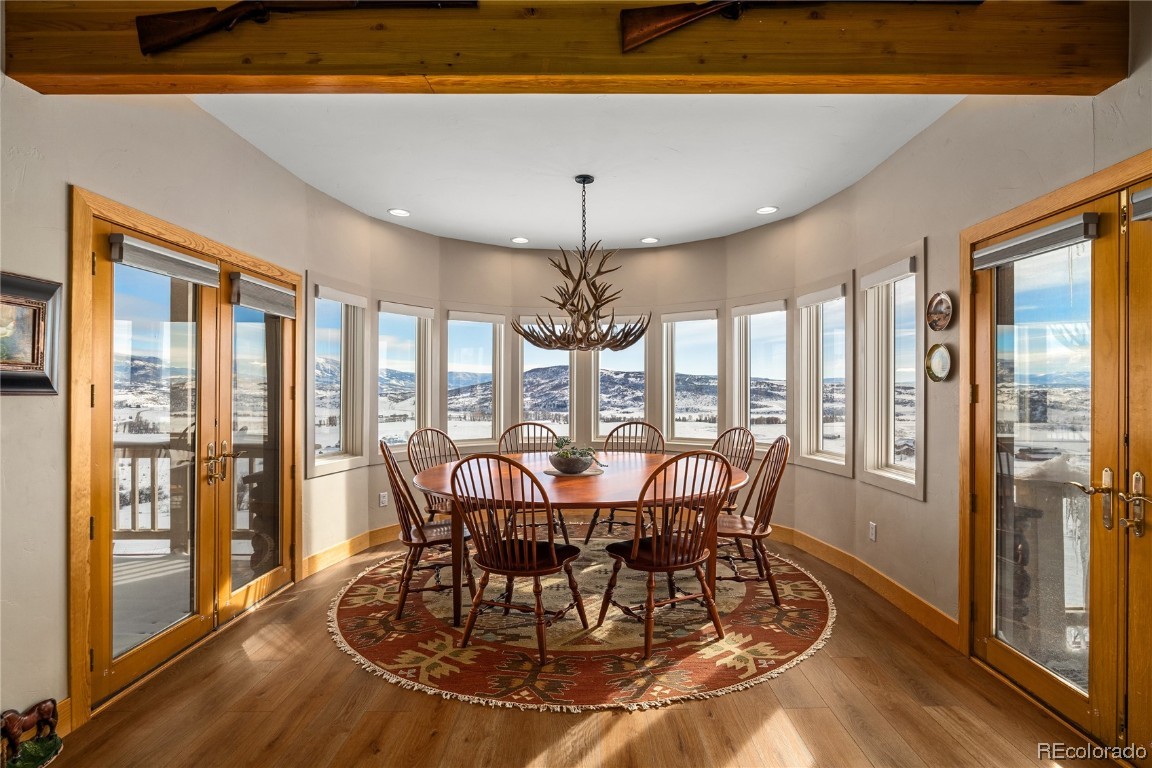 43750 Diamondback Way Steamboat Springs, CO 80487 - Photo 3 of 50 a view of a dining room with furniture window and wooden floor