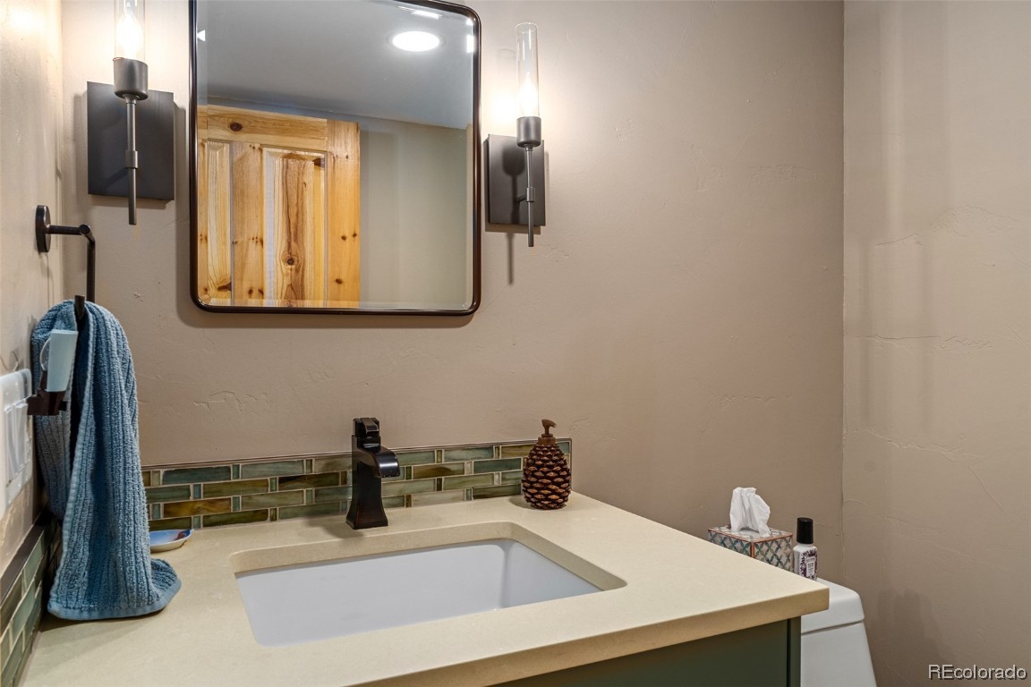 43750 Diamondback Way Steamboat Springs, CO 80487 - Photo 31 of 50 a bathroom with a sink and a mirror