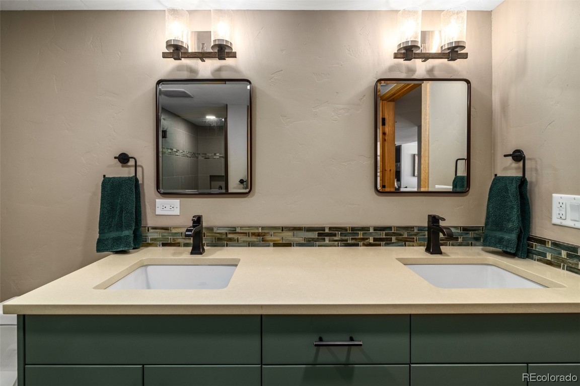 43750 Diamondback Way Steamboat Springs, CO 80487 - Photo 34 of 50 a bathroom with a sink and a mirror