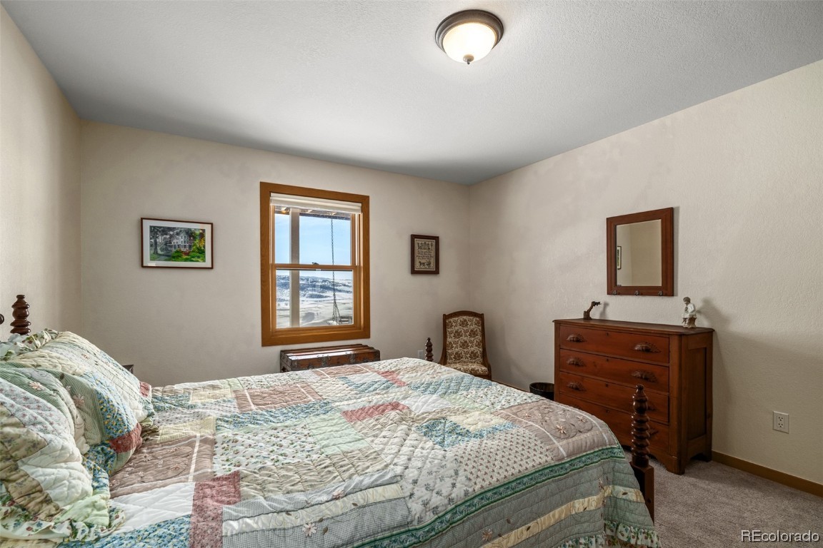 43750 Diamondback Way Steamboat Springs, CO 80487 - Photo 36 of 50 a bedroom with a bed and a dresser