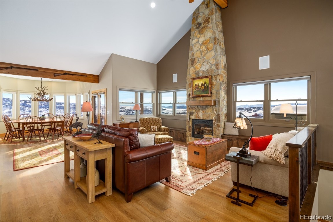 43750 Diamondback Way Steamboat Springs, CO 80487 - Photo 7 of 50 a living room with furniture and a floor to ceiling window