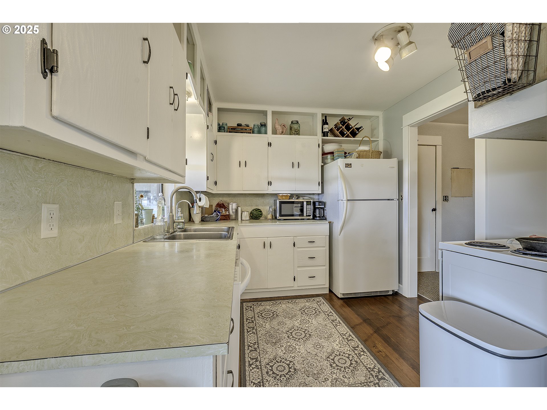 40748 Northwest Verboort Road Forest Grove, OR 97116 - Photo 17 of 28 a kitchen with refrigerator and cabinets