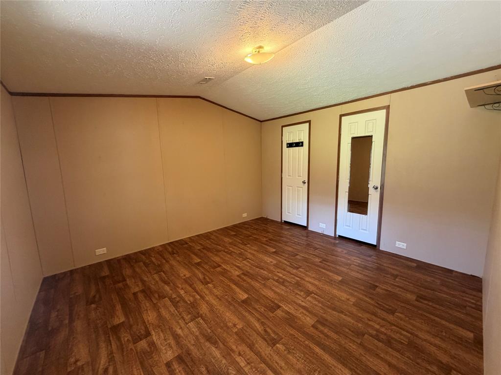985 Indian Gap Quitman, TX 75783 - Photo 11 of 20 wooden floor in an empty room with a window
