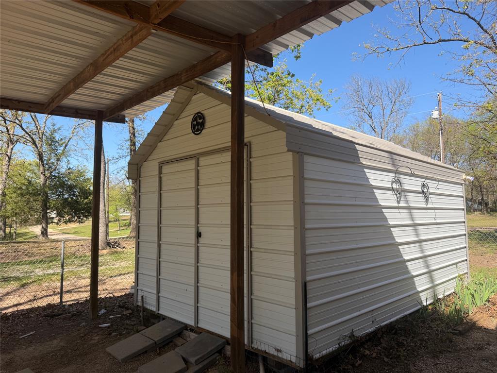 985 Indian Gap Quitman, TX 75783 - Photo 14 of 20 a view of a porch with a yard