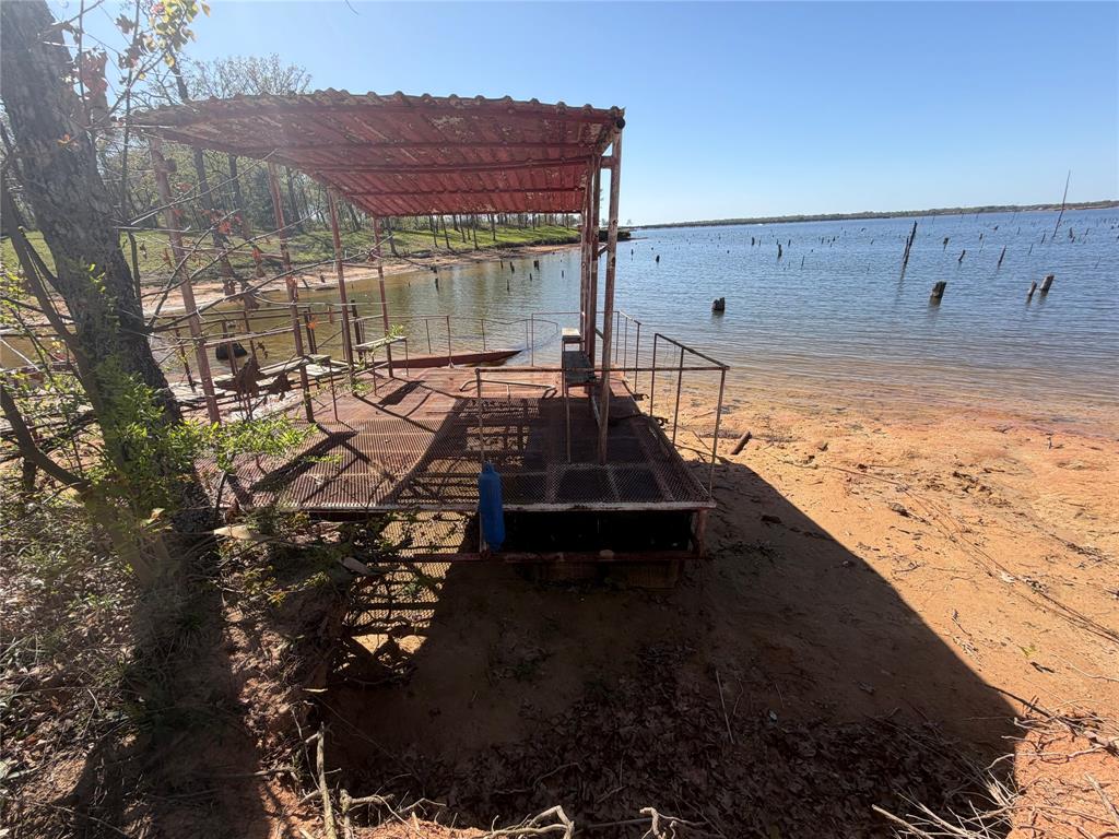 985 Indian Gap Quitman, TX 75783 - Photo 18 of 20 a view of a backyard with wooden fence