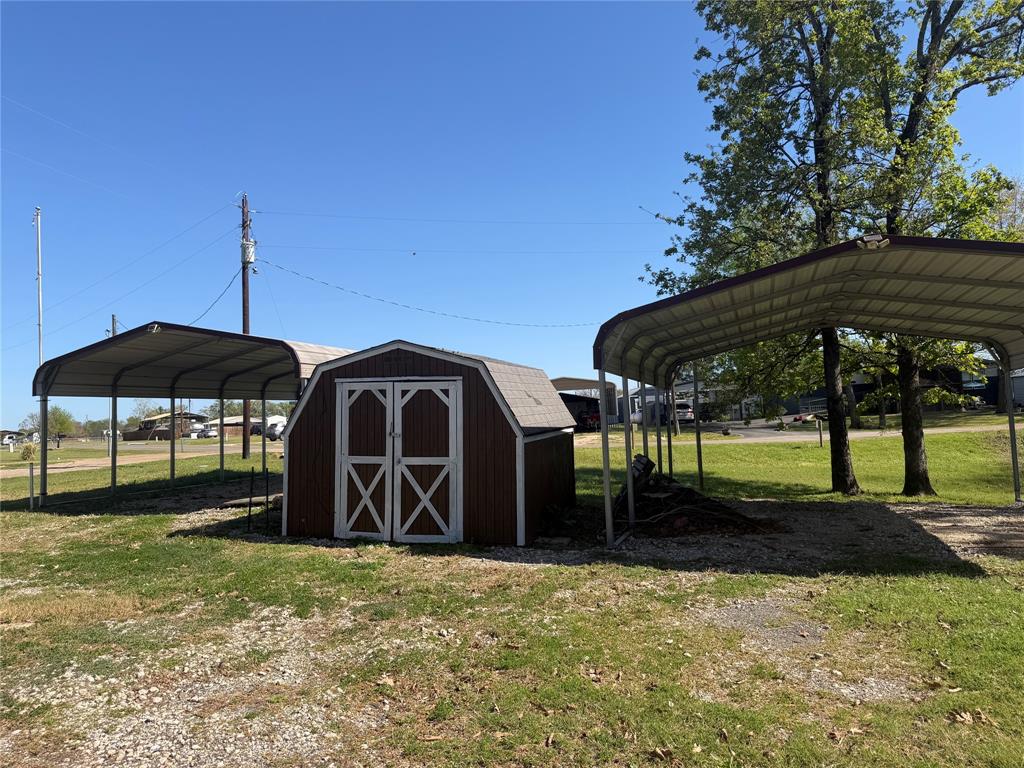 985 Indian Gap Quitman, TX 75783 - Photo 3 of 20 a front view of house with a garden