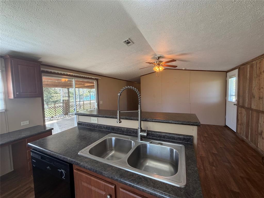 985 Indian Gap Quitman, TX 75783 - Photo 8 of 20 a kitchen with a sink and a refrigerator