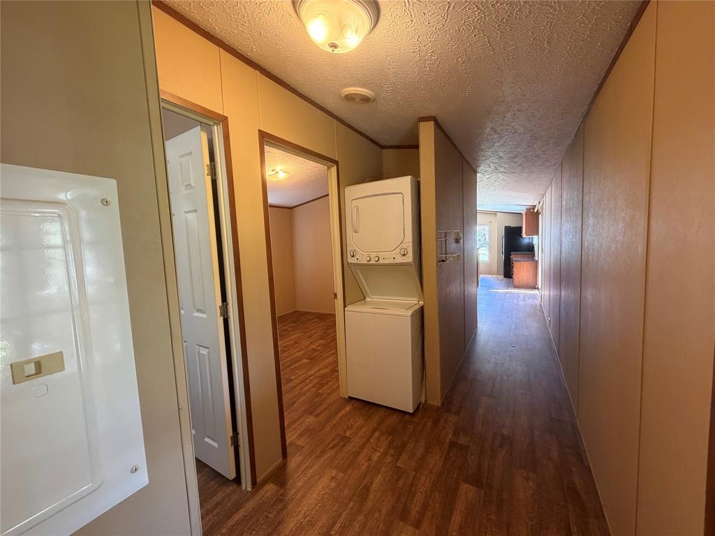 985 Indian Gap Quitman, TX 75783 - Photo 9 of 20 a view of a hallway with wooden floor and cabinets