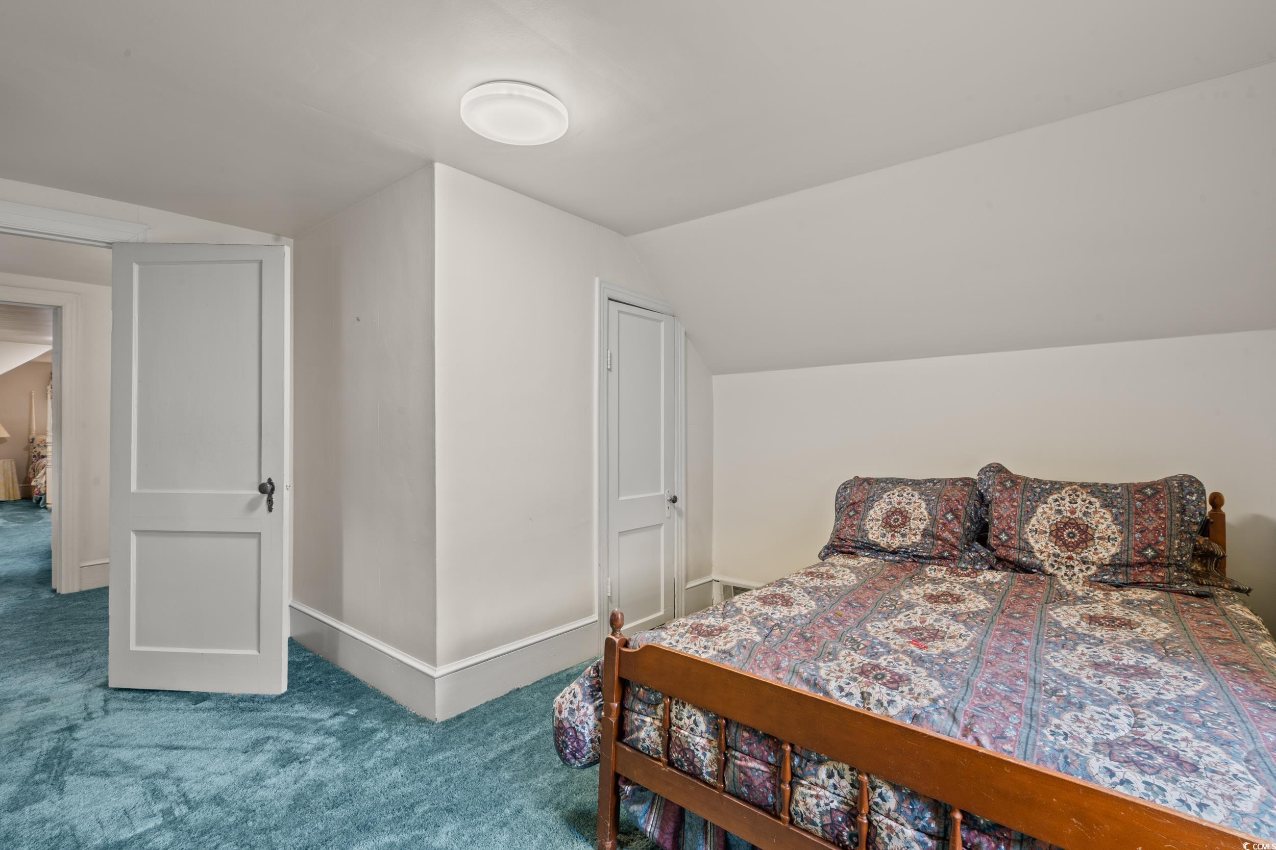 310 North Main Street Mullins, SC 29574 - Photo 19 of 35 Bedroom with carpet flooring and vaulted ceiling