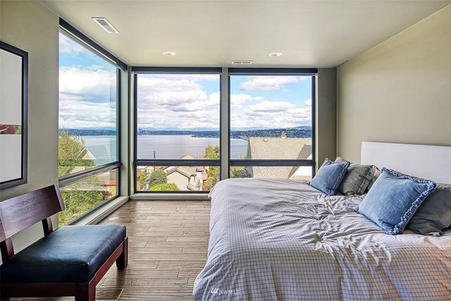 a spacious bathroom with a sink mirror and a bath tub