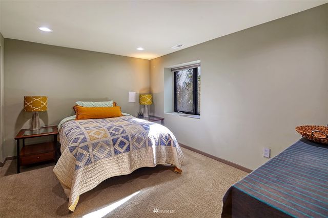 a utility room with dryer washer and a window