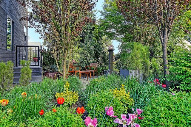 an aerial view of house with yard swimming pool and outdoor seating
