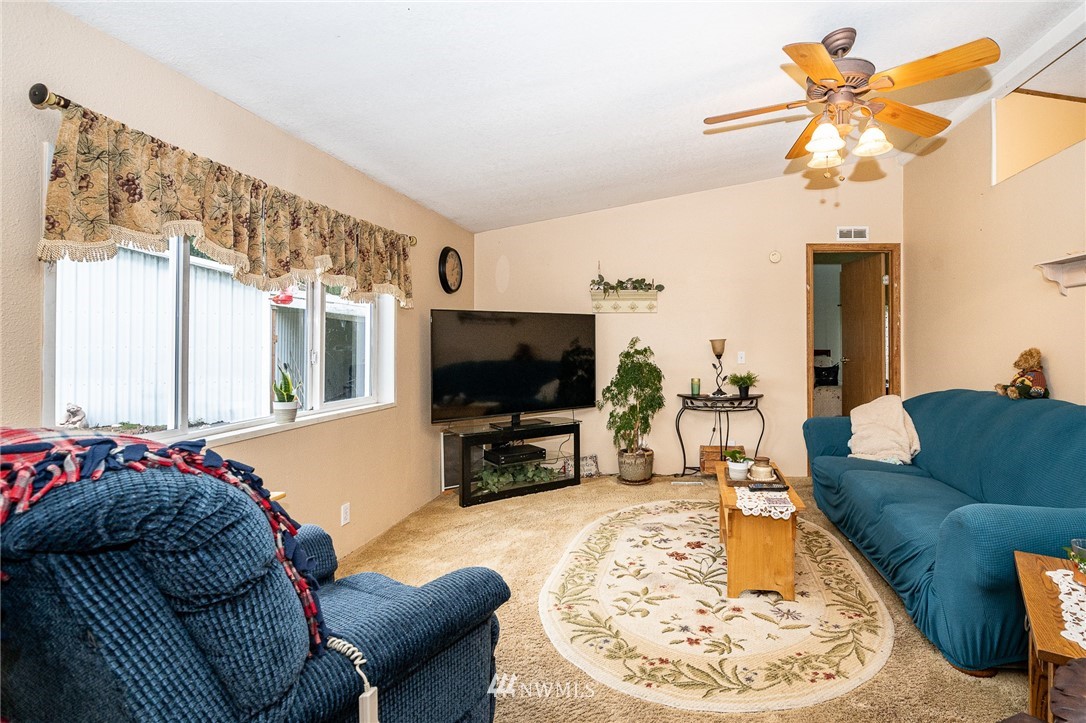 368 Jones Road Winlock, WA 98596 - Photo 11 of 39 a living room with furniture and a flat screen tv