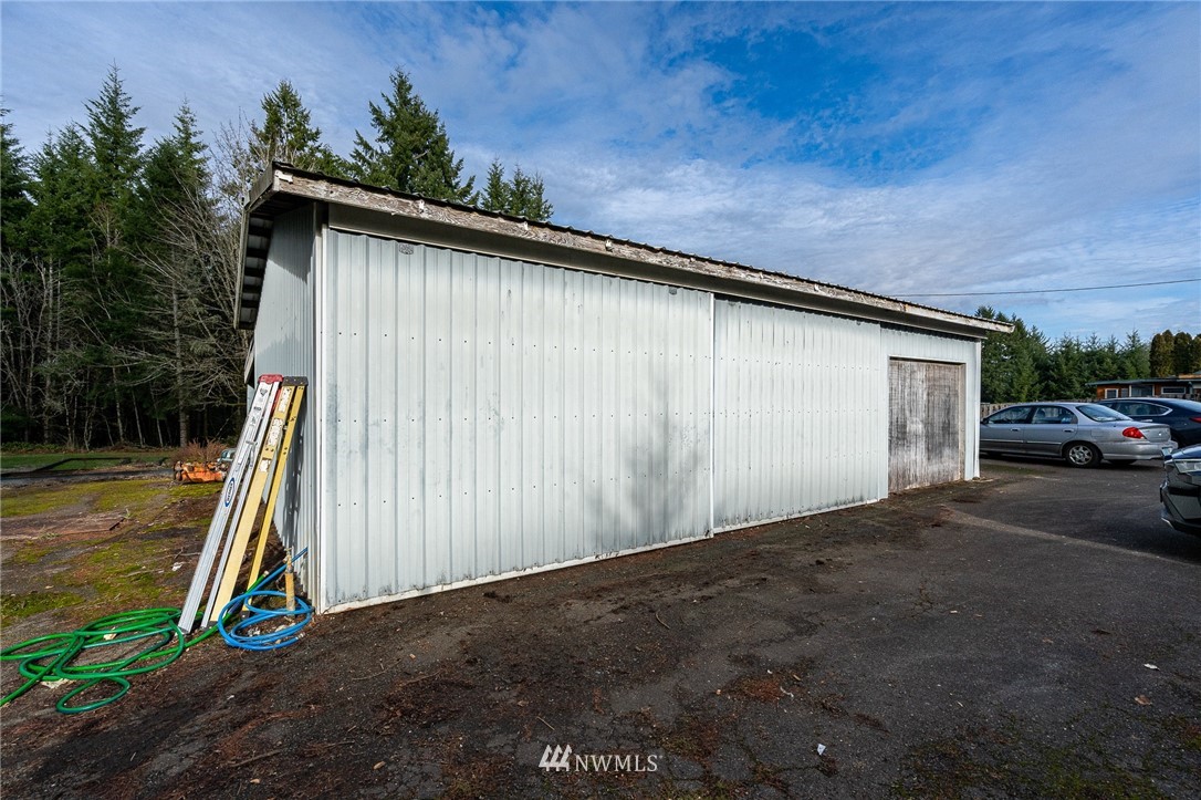 368 Jones Road Winlock, WA 98596 - Photo 36 of 39 a view of a house with backyard and trees
