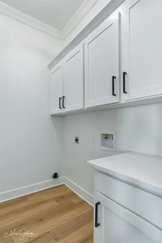 a kitchen with stainless steel appliances granite countertop a sink dishwasher a refrigerator and a stove with wooden floor