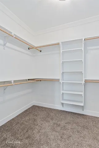 a view of an empty walk in closet