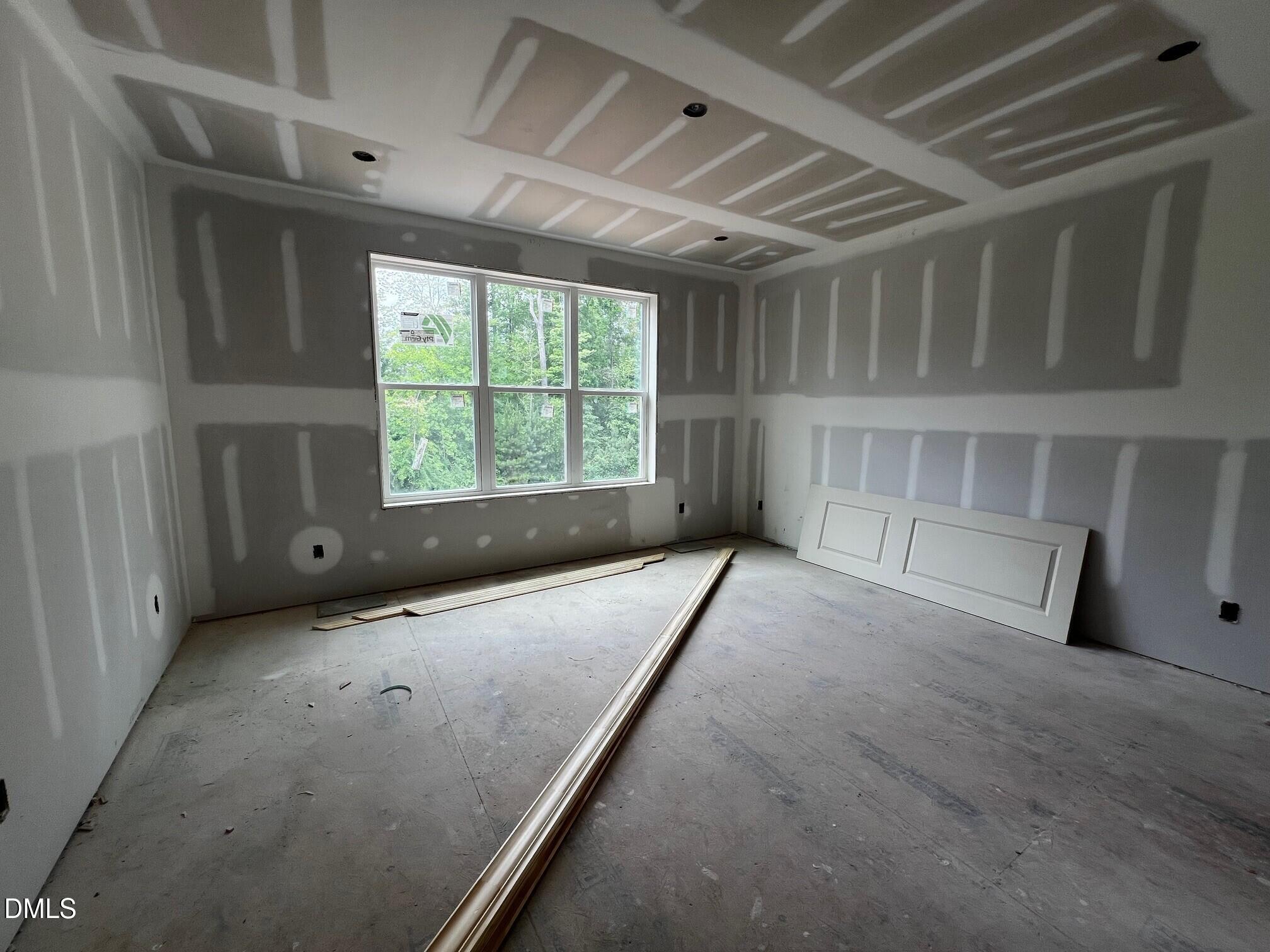 1675 Terry Road Durham, NC 27712 - Photo 6 of 23 a view of an empty room with a window