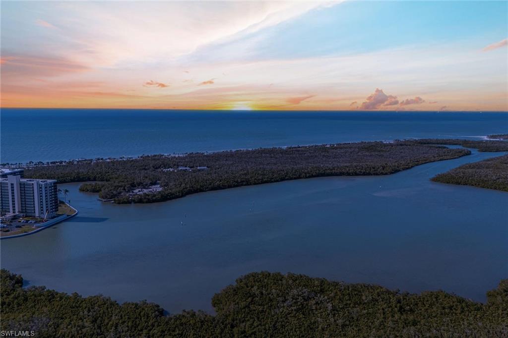 295 Grande Way, Unit PH2 Naples, FL 34110 - Photo 45 of 45 a sunset view with ocean view