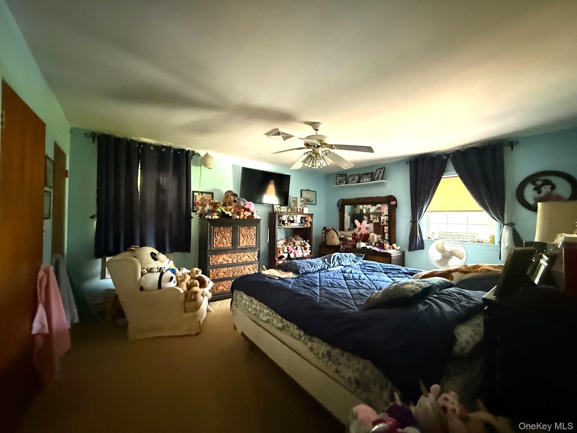 51 Depot Hill Road Amenia, NY 12501 - Photo 12 of 18 a living room with furniture and a chandelier