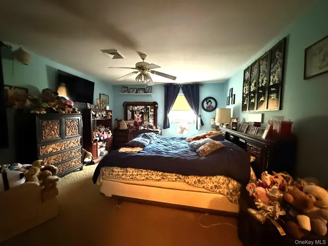 a bed sitting in a room next to a window