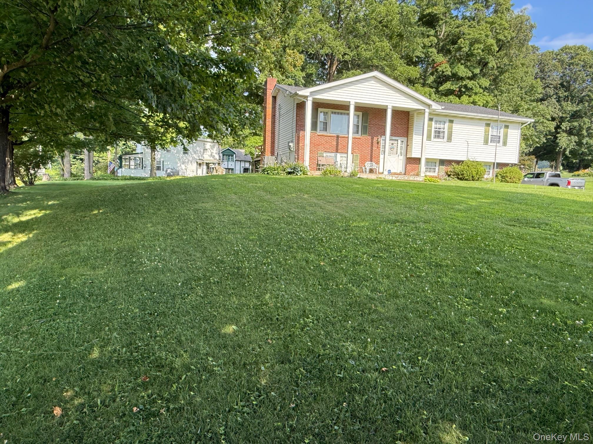 51 Depot Hill Road Amenia, NY 12501 - Photo 16 of 18 a front view of a house with a yard