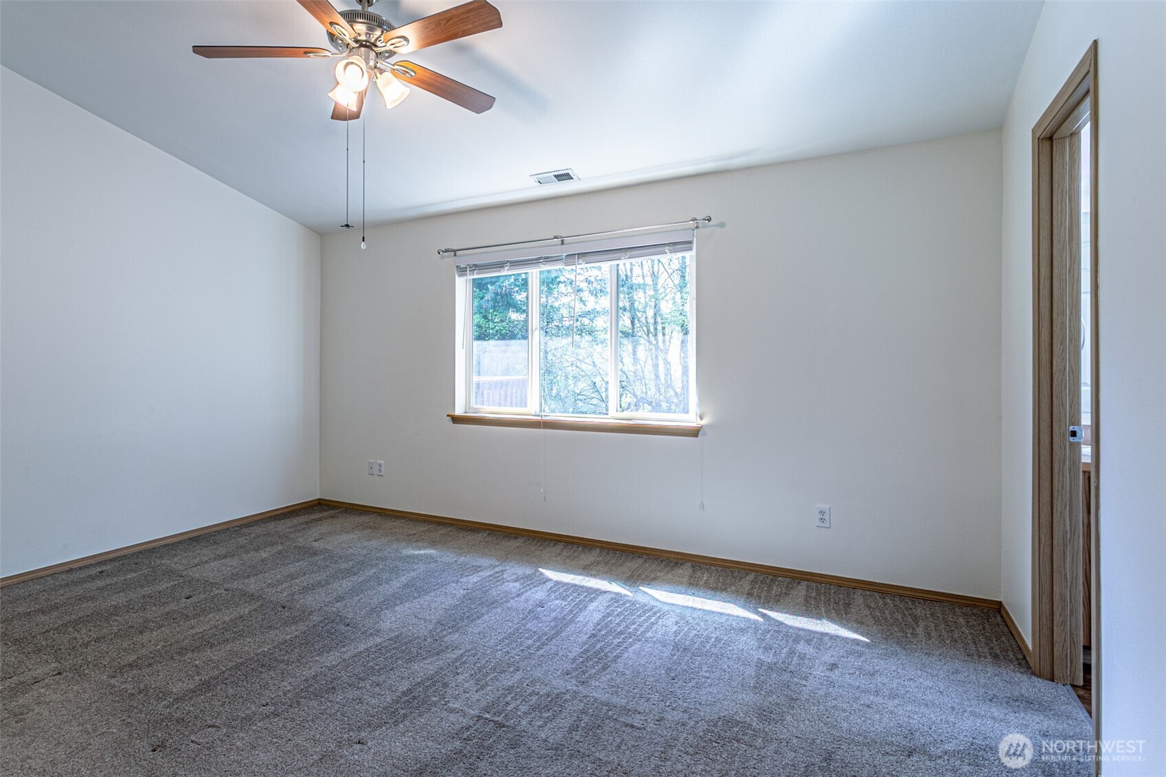 8342 49th Loop Southeast Olympia, WA 98513 - Photo 12 of 24 an empty room with a window and a fan