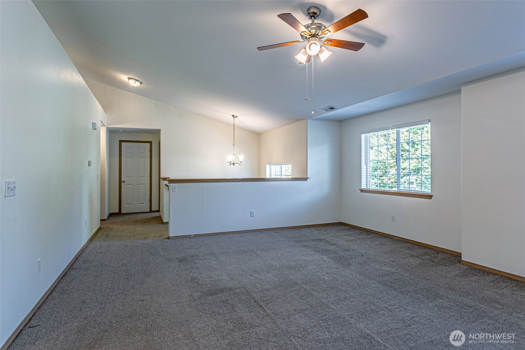 8342 49th Loop Southeast Olympia, WA 98513 - Photo 4 of 24 an empty room with windows and fan