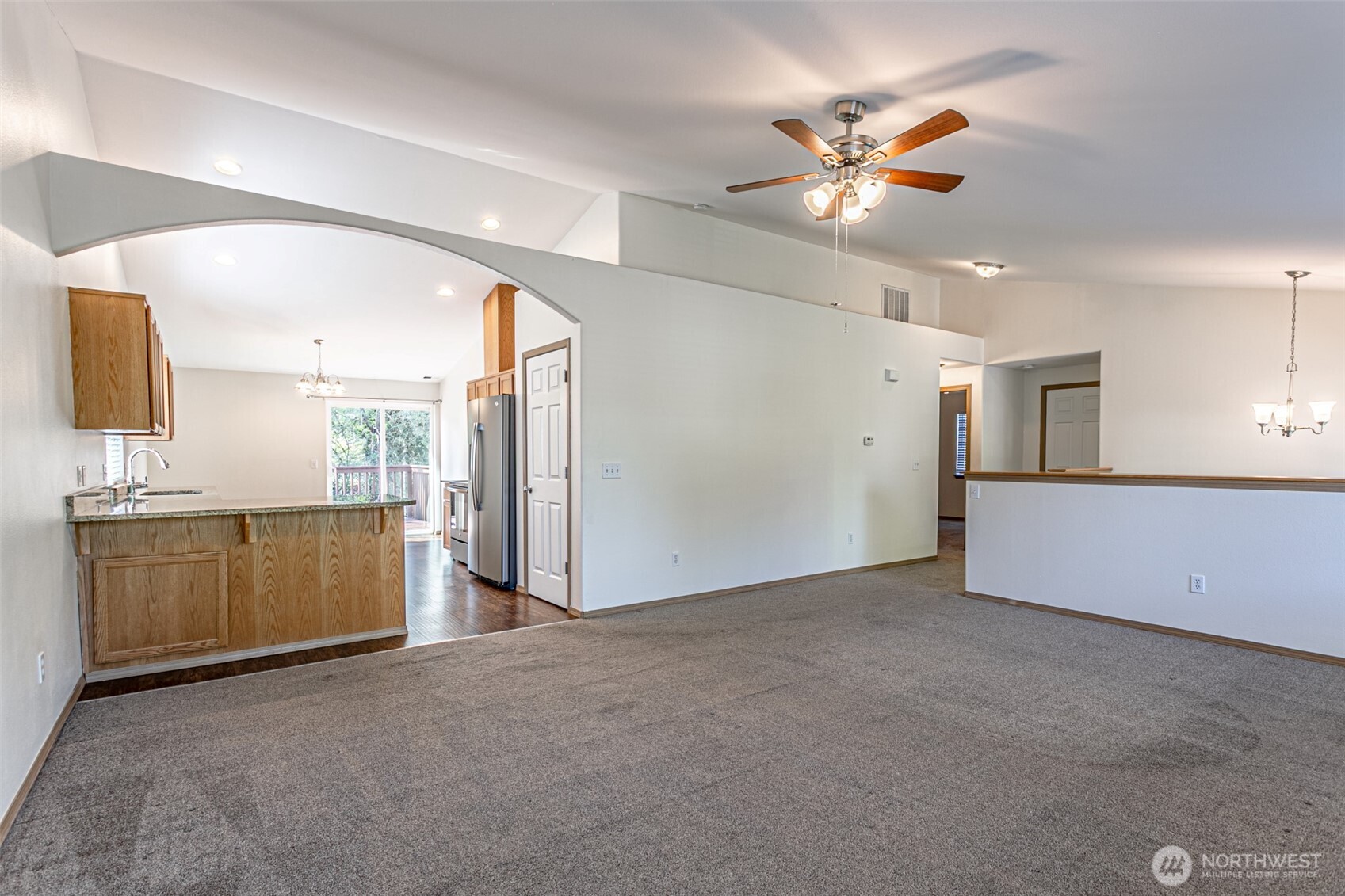 8342 49th Loop Southeast Olympia, WA 98513 - Photo 6 of 24 a view of an empty room with a kitchen