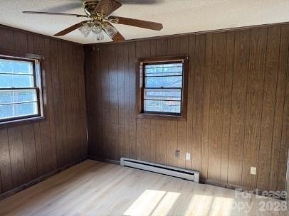 1568 Barringer Street Mount Pleasant, NC 28124 - Photo 3 of 11 an empty room with windows and fan