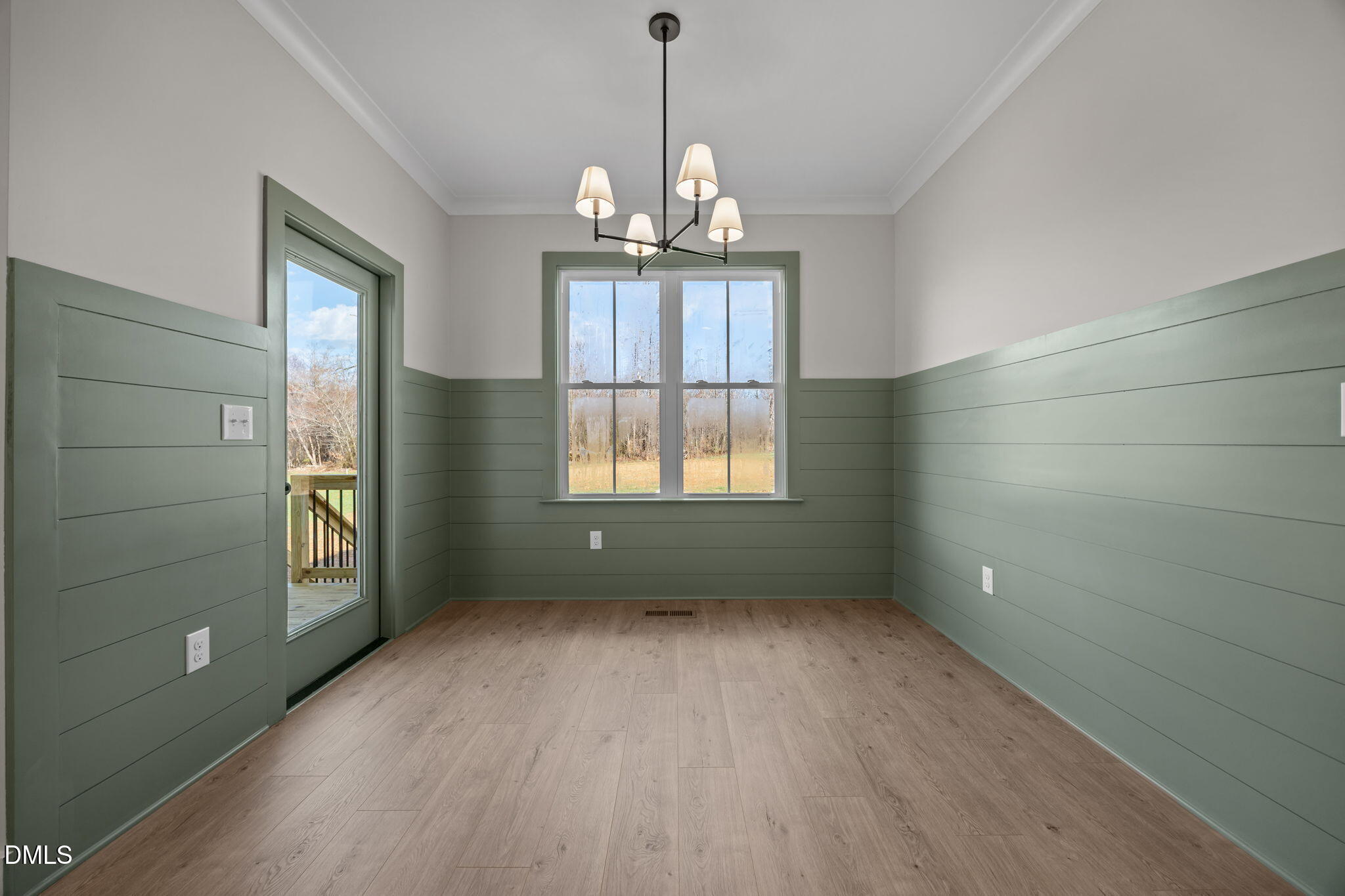 1225 Antioch Church Road Timberlake, NC 27583 - Photo 13 of 45 a view of an empty room with window and wooden floor