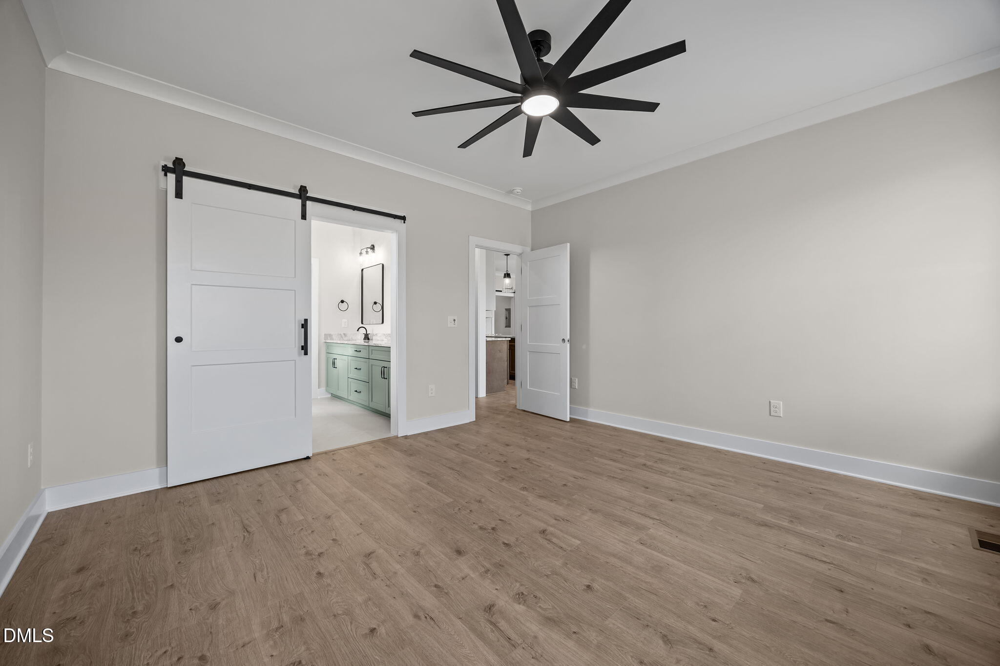 1225 Antioch Church Road Timberlake, NC 27583 - Photo 20 of 45 a view of a big room with wooden floor and a chandelier fan