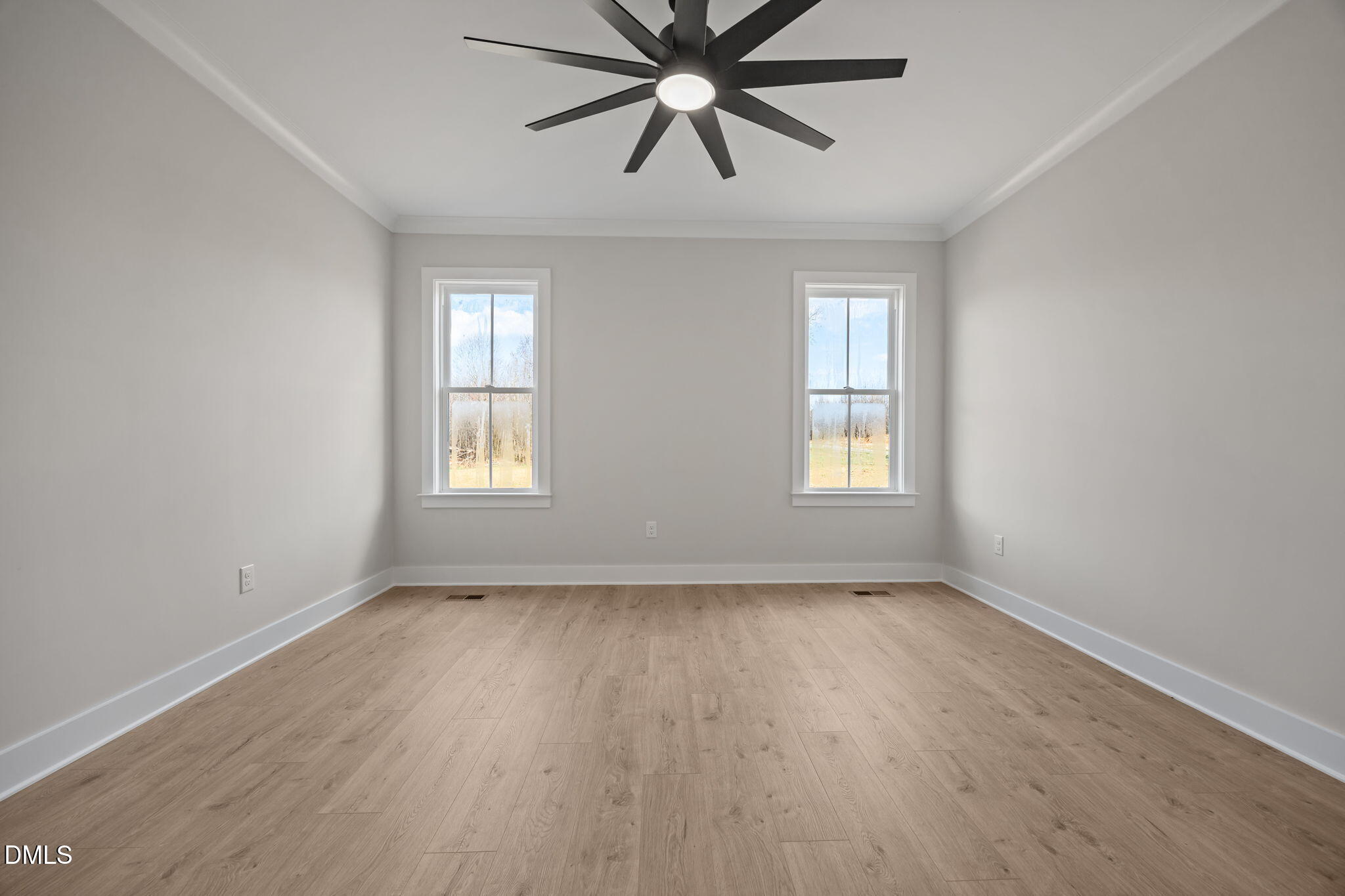 1225 Antioch Church Road Timberlake, NC 27583 - Photo 22 of 45 a view of an empty room with window and wooden floor