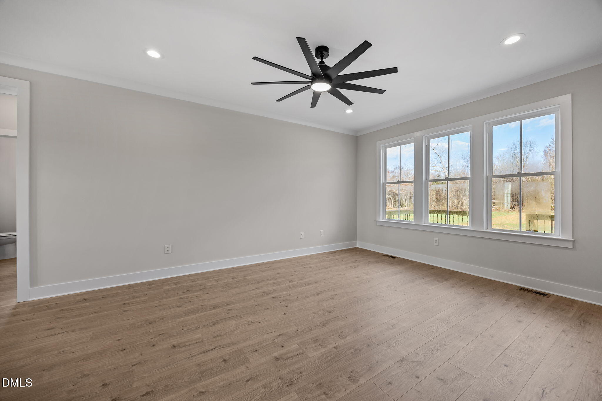 1225 Antioch Church Road Timberlake, NC 27583 - Photo 23 of 45 an empty room with windows and fan