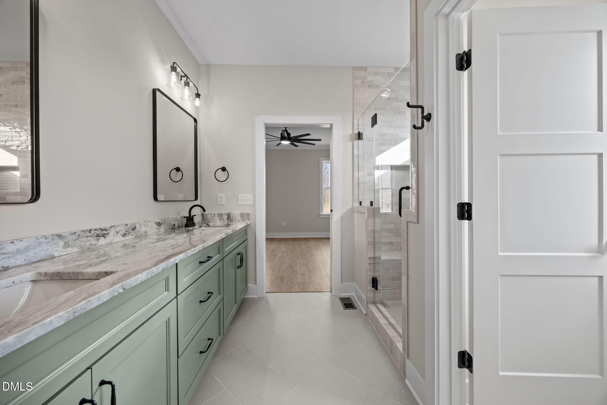 1225 Antioch Church Road Timberlake, NC 27583 - Photo 25 of 45 a spacious bathroom with a granite countertop sink mirror and shower