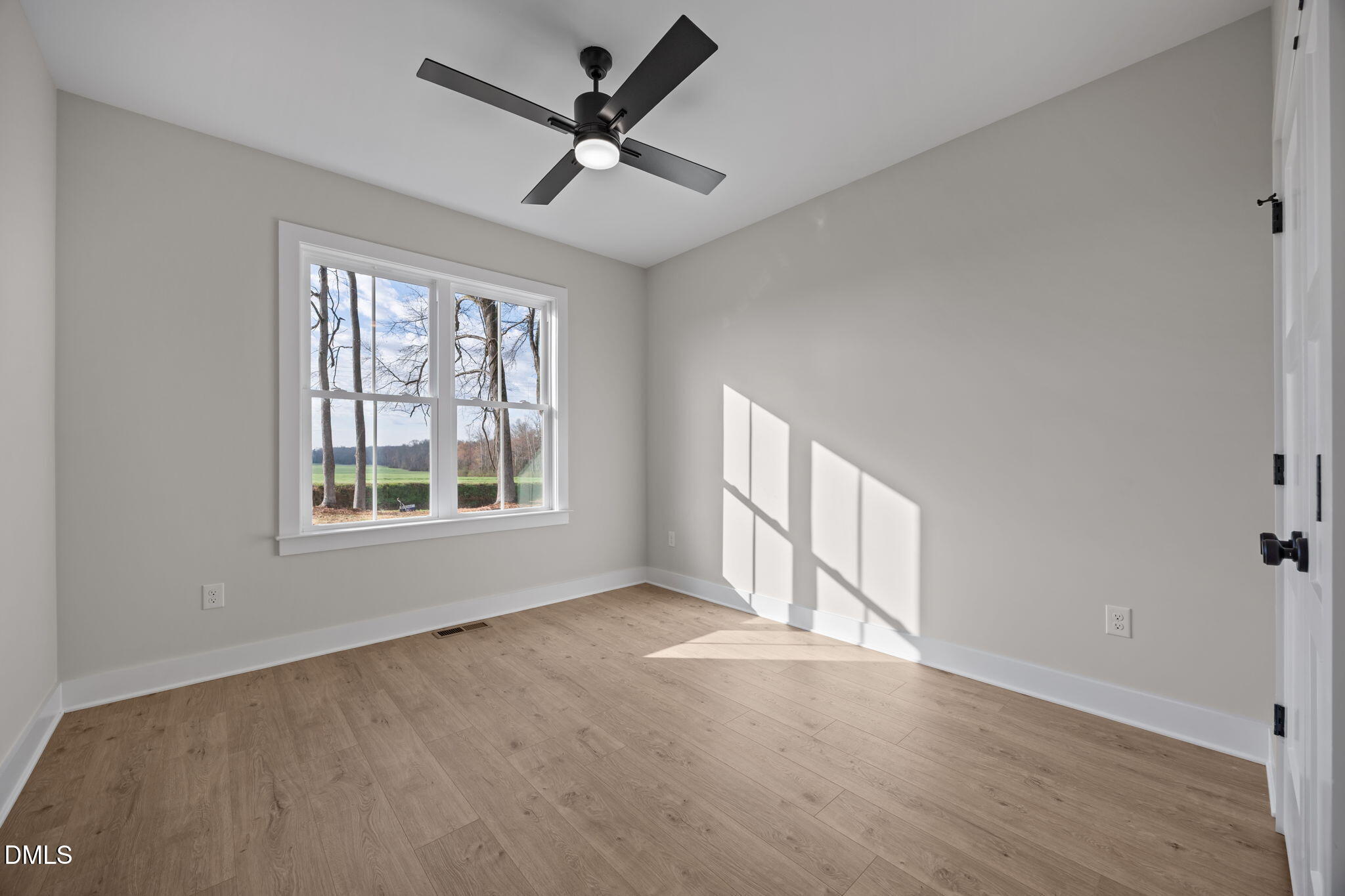 1225 Antioch Church Road Timberlake, NC 27583 - Photo 28 of 45 a view of an empty room with a window