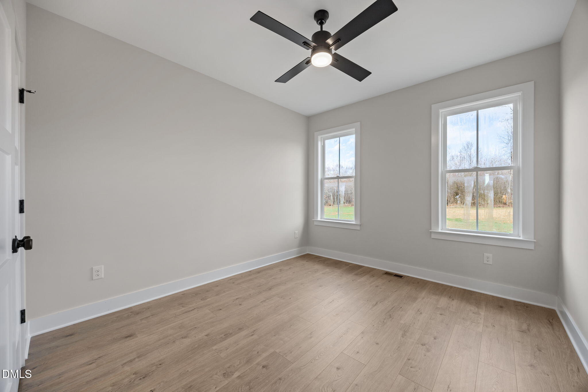1225 Antioch Church Road Timberlake, NC 27583 - Photo 30 of 45 wooden floor in an empty room with a window