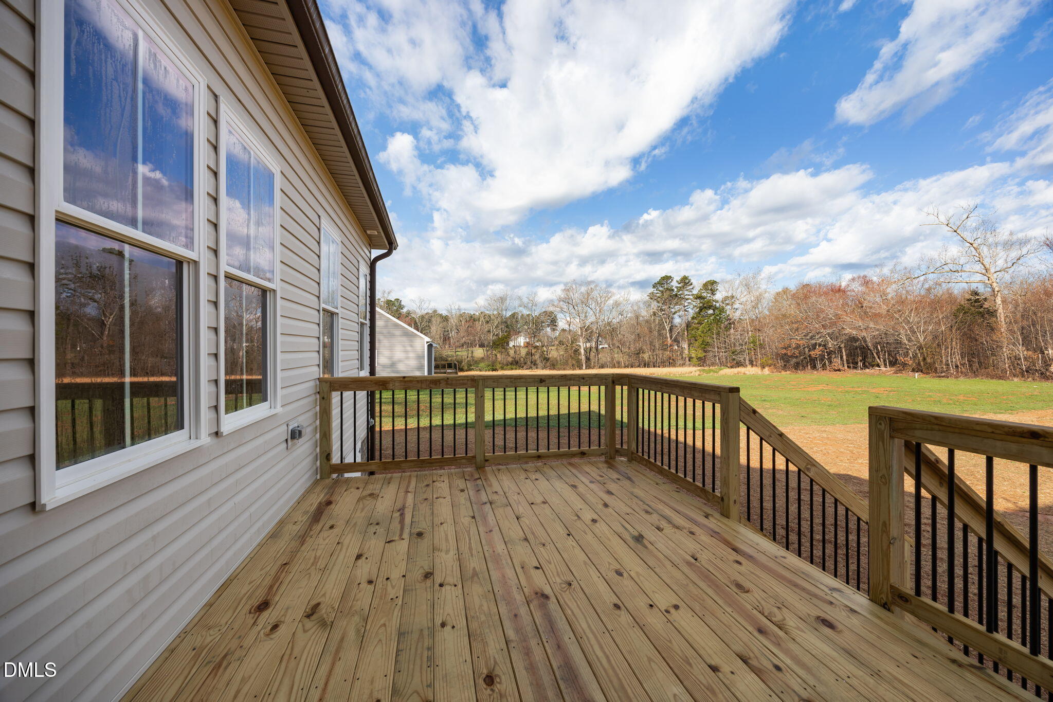 1225 Antioch Church Road Timberlake, NC 27583 - Photo 35 of 45 a view of a balcony with wooden floor