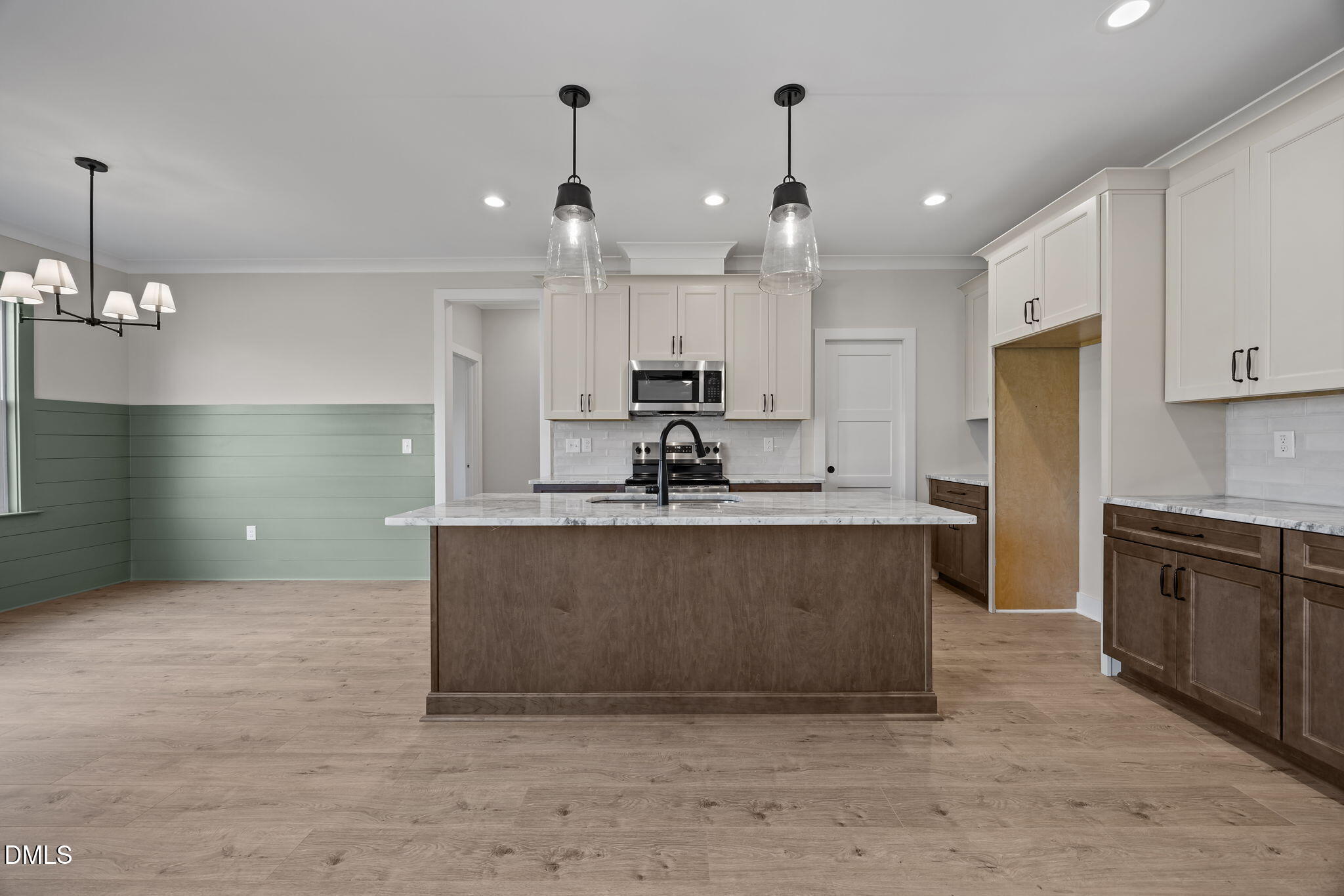 1225 Antioch Church Road Timberlake, NC 27583 - Photo 9 of 45 a large kitchen with kitchen island a sink stainless steel appliances and cabinets