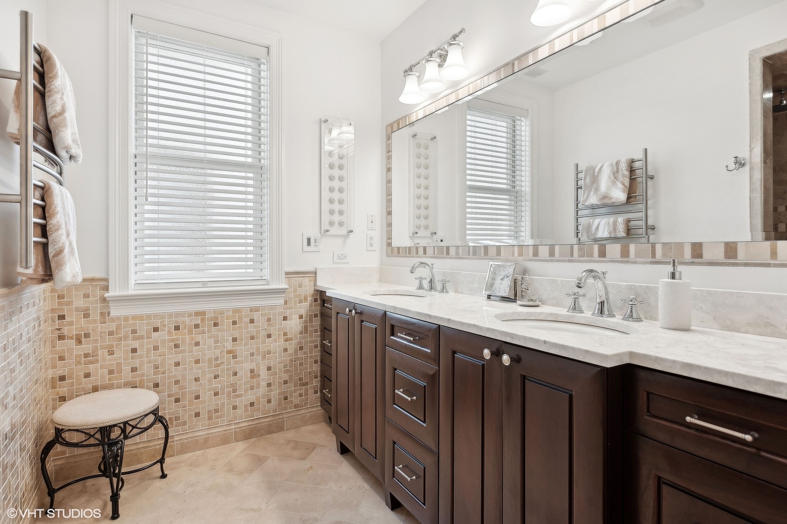 1429 West Cullom Avenue Chicago, IL 60613 - Photo 24 of 53 a bathroom with a double vanity sink a mirror and a bathtub