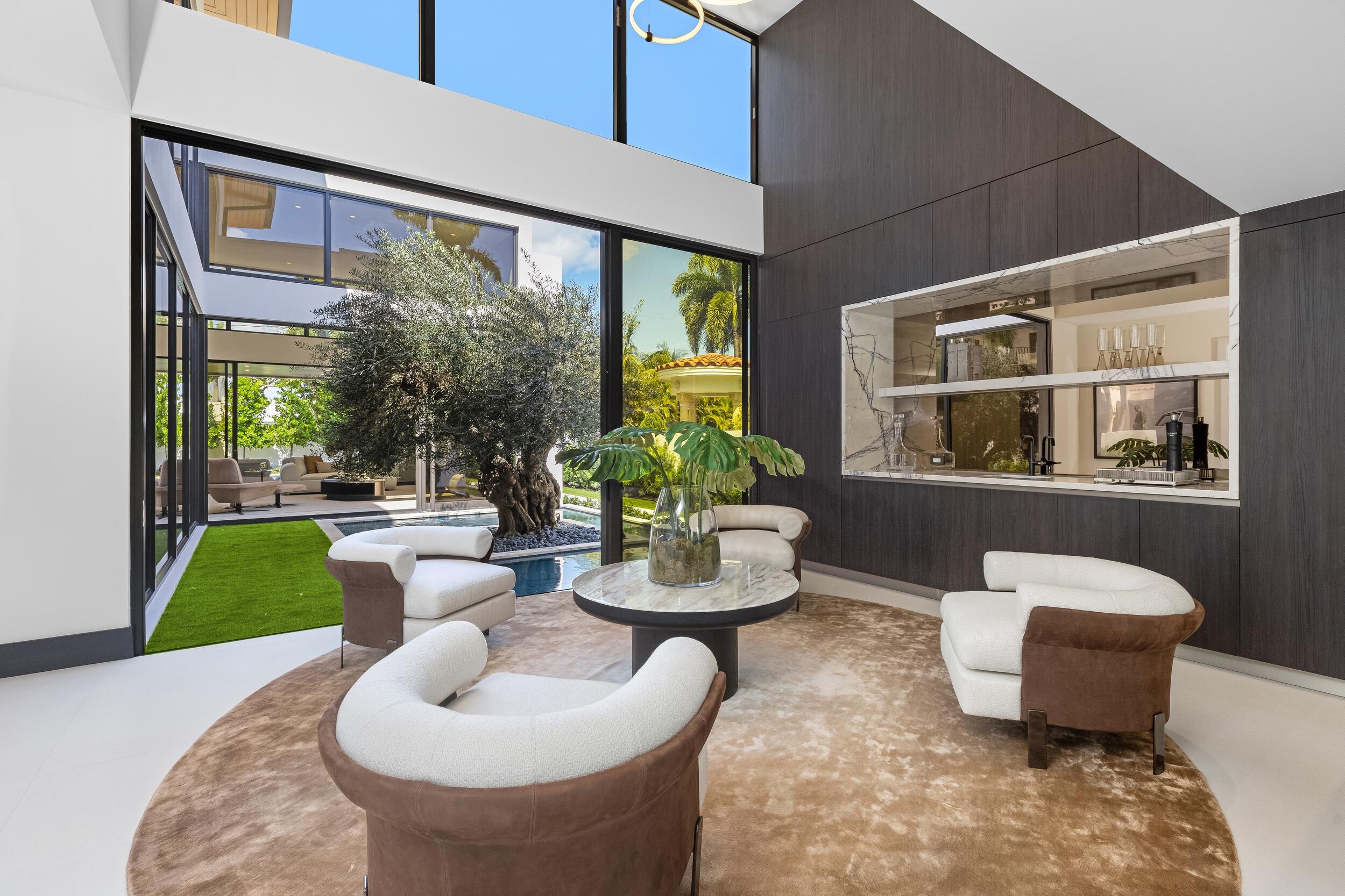 1351 Cocoanut Road Boca Raton, FL 33432 - Photo 20 of 101 a living room with furniture and a potted plant
