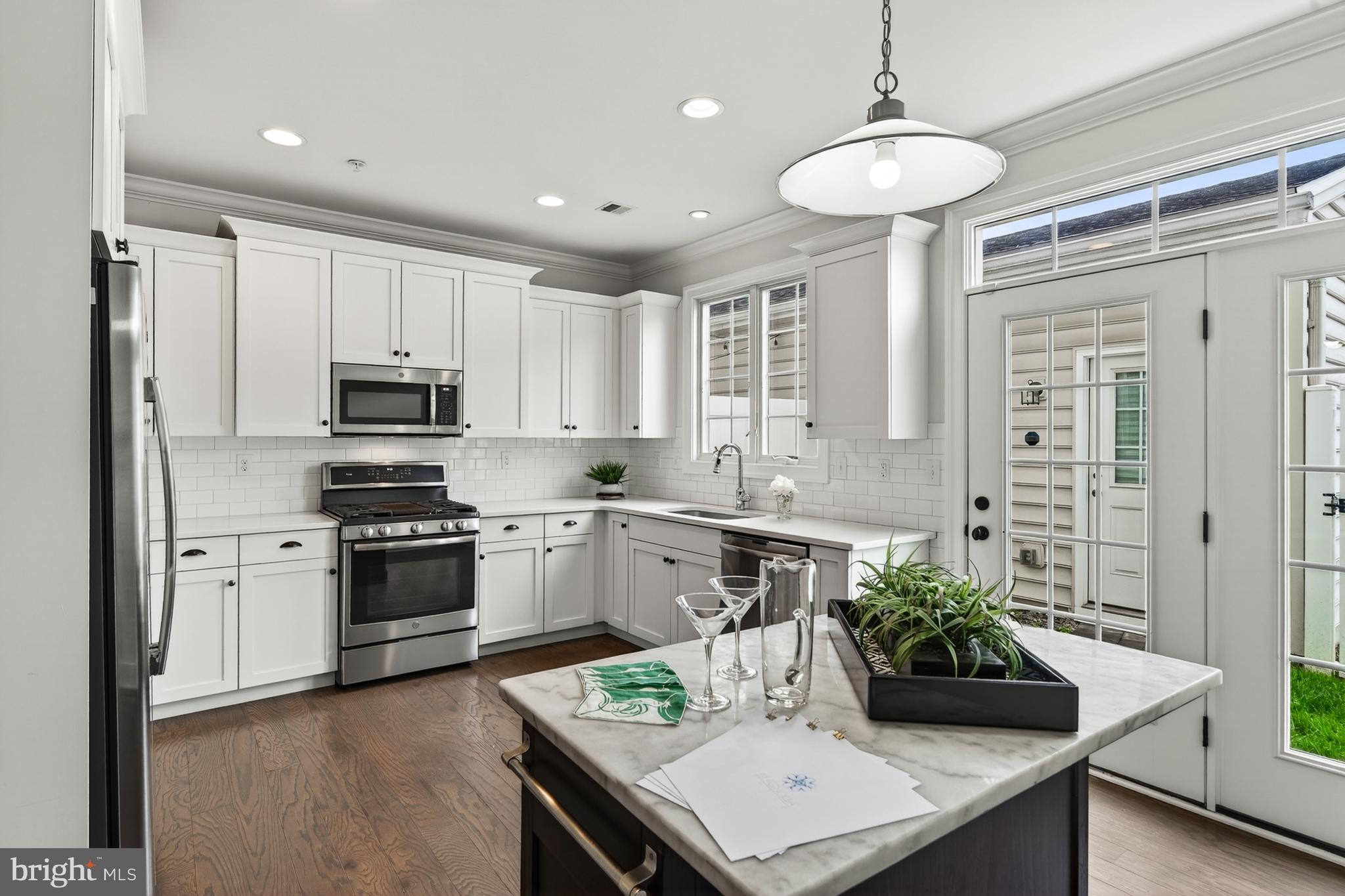 610 D Street Kennett Square, PA 19348 - Photo 8 of 24 Clean white kitchen with subway backsplash