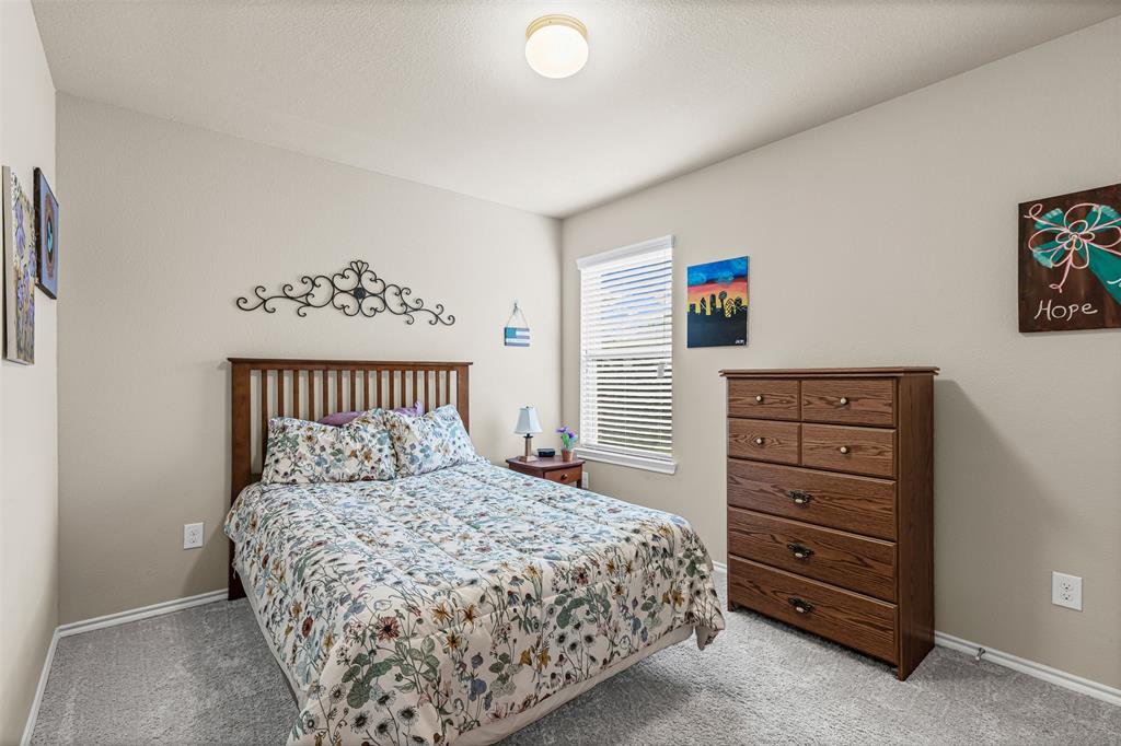1104 Ruby Court Princeton, TX 75407 - Photo 12 of 40 a bedroom with a bed and a window