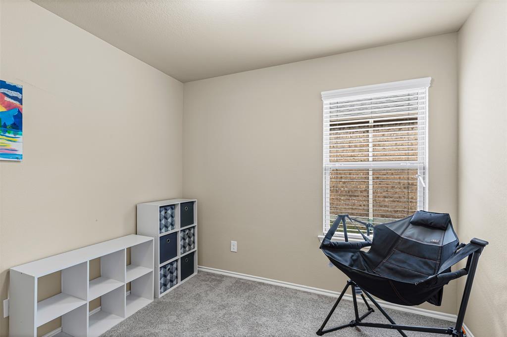 1104 Ruby Court Princeton, TX 75407 - Photo 13 of 40 a view of a workspace with furniture and a window