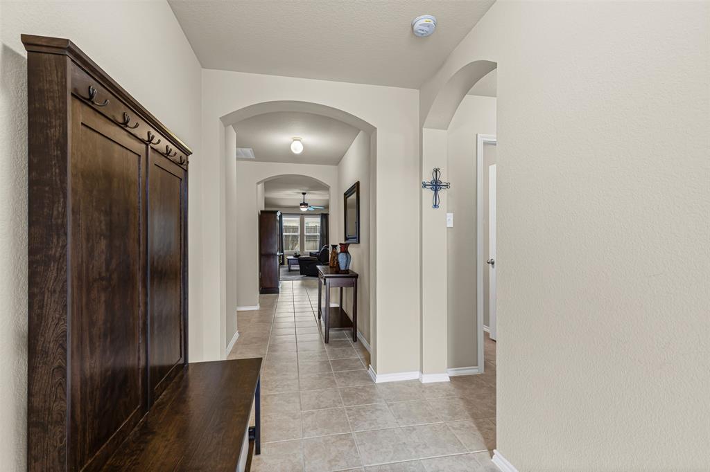 1104 Ruby Court Princeton, TX 75407 - Photo 2 of 40 a view of a hallway with wooden floor windows and a living room