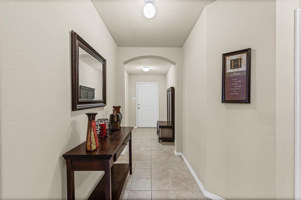 1104 Ruby Court Princeton, TX 75407 - Photo 20 of 40 a view of a hallway with entryway and furniture