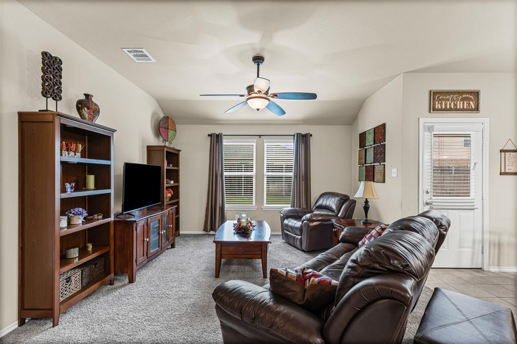 1104 Ruby Court Princeton, TX 75407 - Photo 21 of 40 a living room with furniture a window and a flat screen tv
